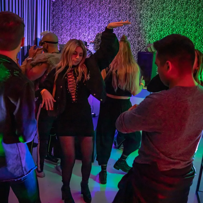 a group of people standing in a room