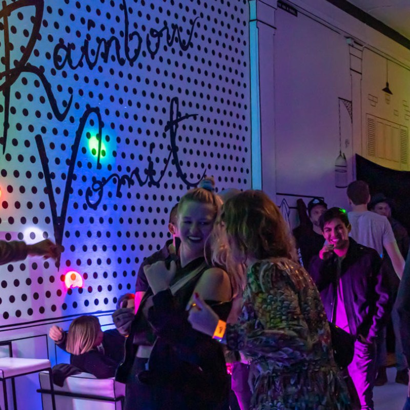 a group of people standing in a room