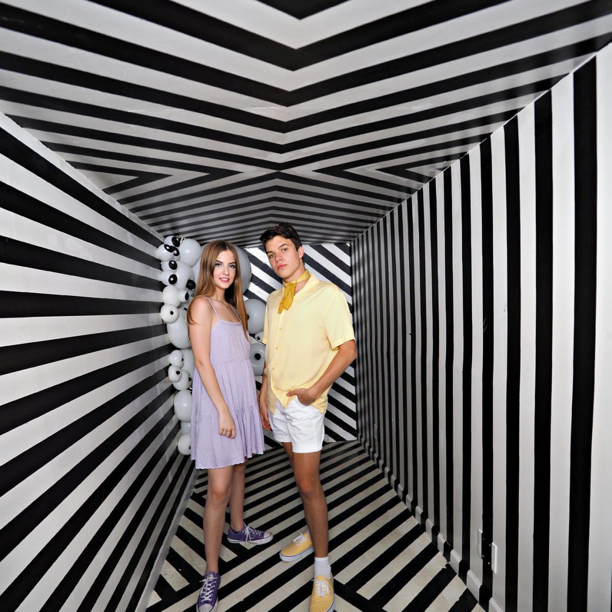 a person in a striped umbrella