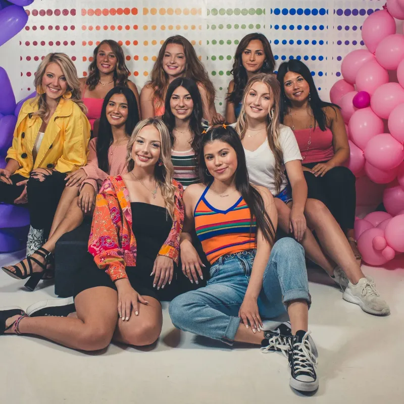 a group of people sitting posing for the camera