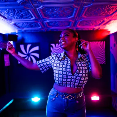 a woman standing in front of a stage